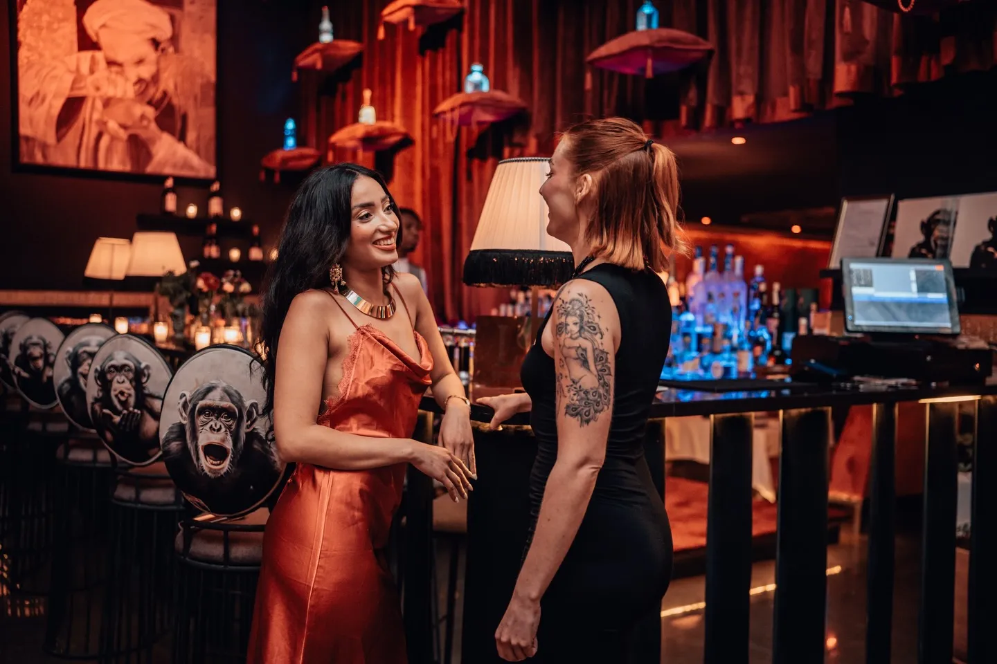 Two guests talking at the bar at LOV