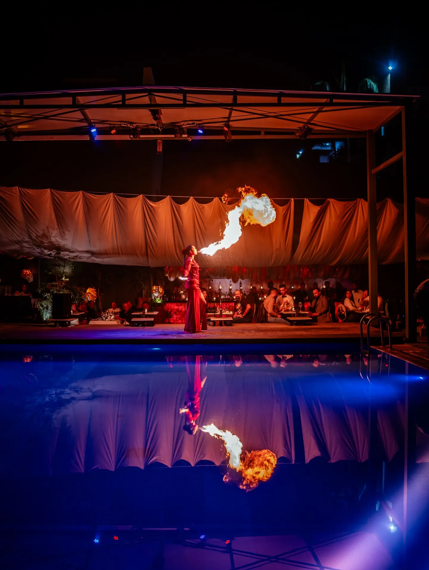 Fire performance beside the pool during a night at LOV